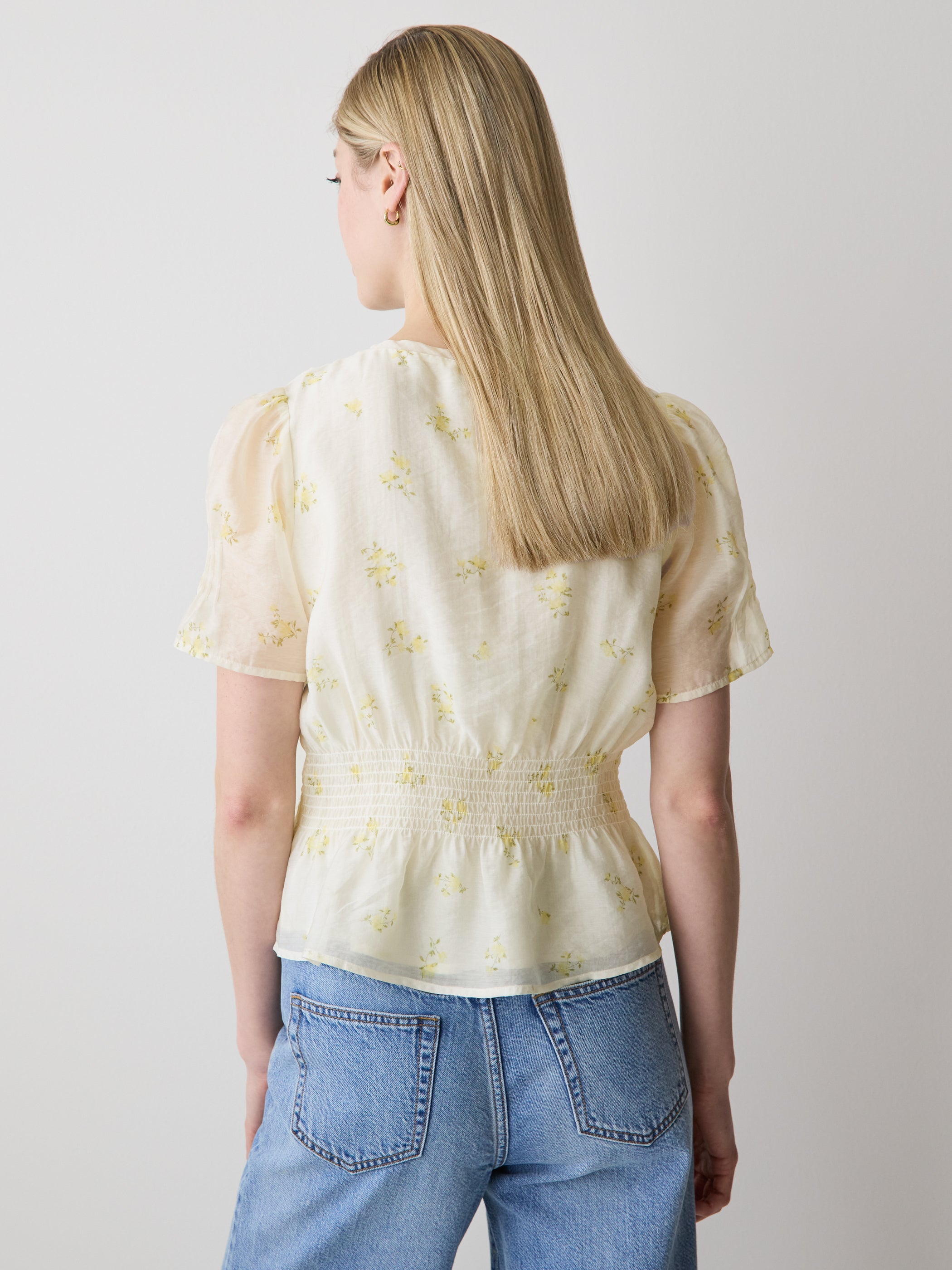 Sleeveless V-Neck Peplum Blouse