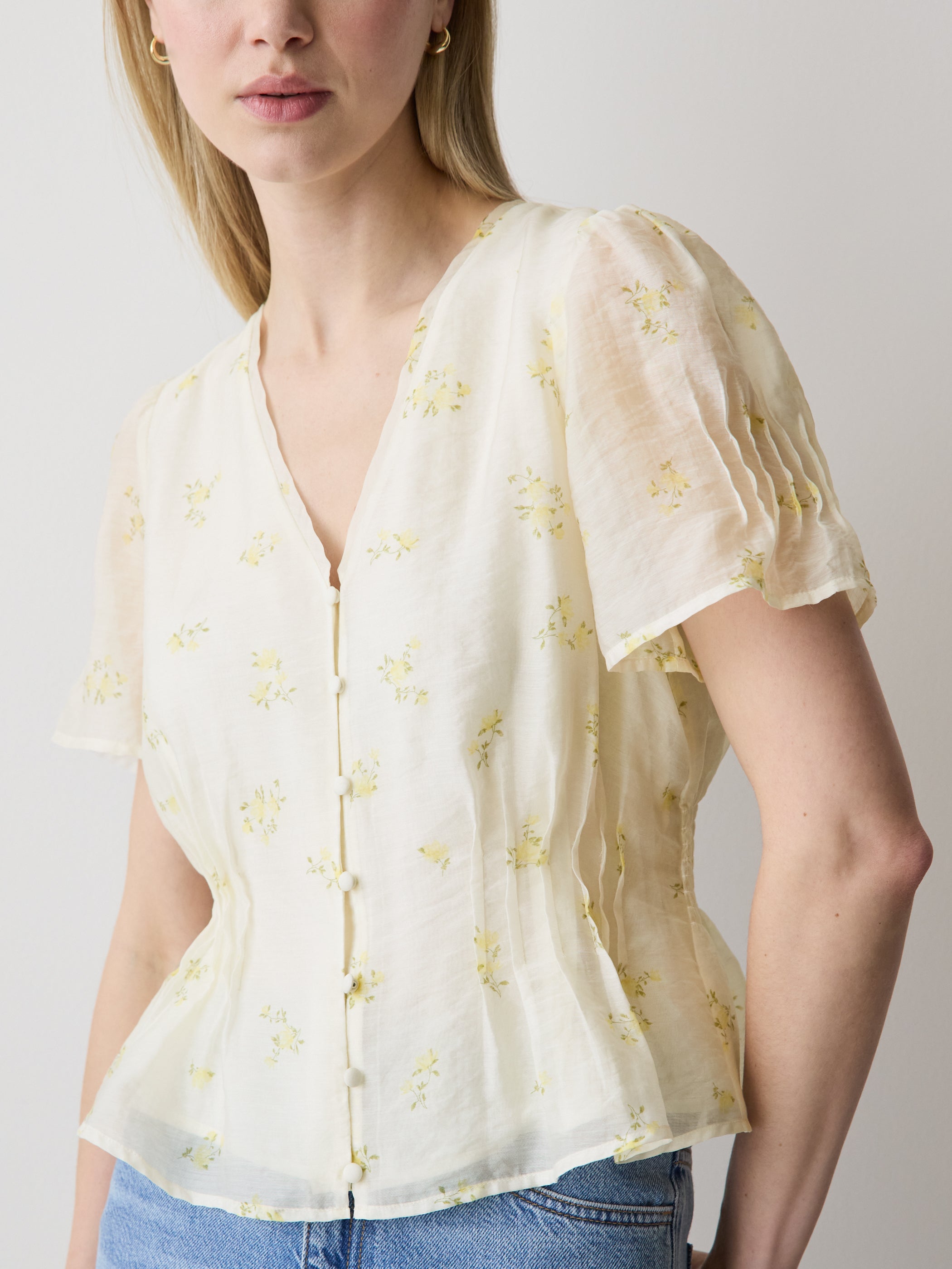 Sleeveless V-Neck Peplum Blouse