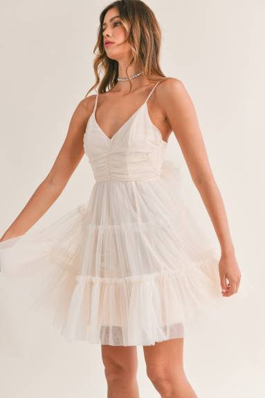 Mini-robe en tulle avec nœud dans le dos en maille